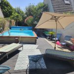 Terrasse d'une piscine après rénovation par Artech Habitat